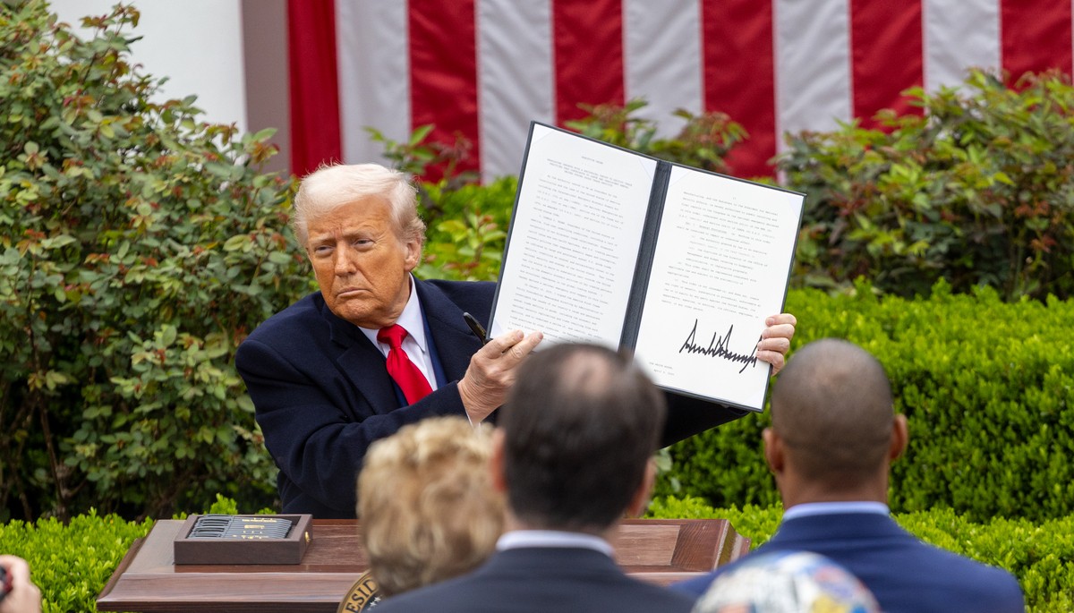 U.S. President Donald Trump displays the executive order on reciprocal tariffs on April 2nd at the White House's Rose Garden.