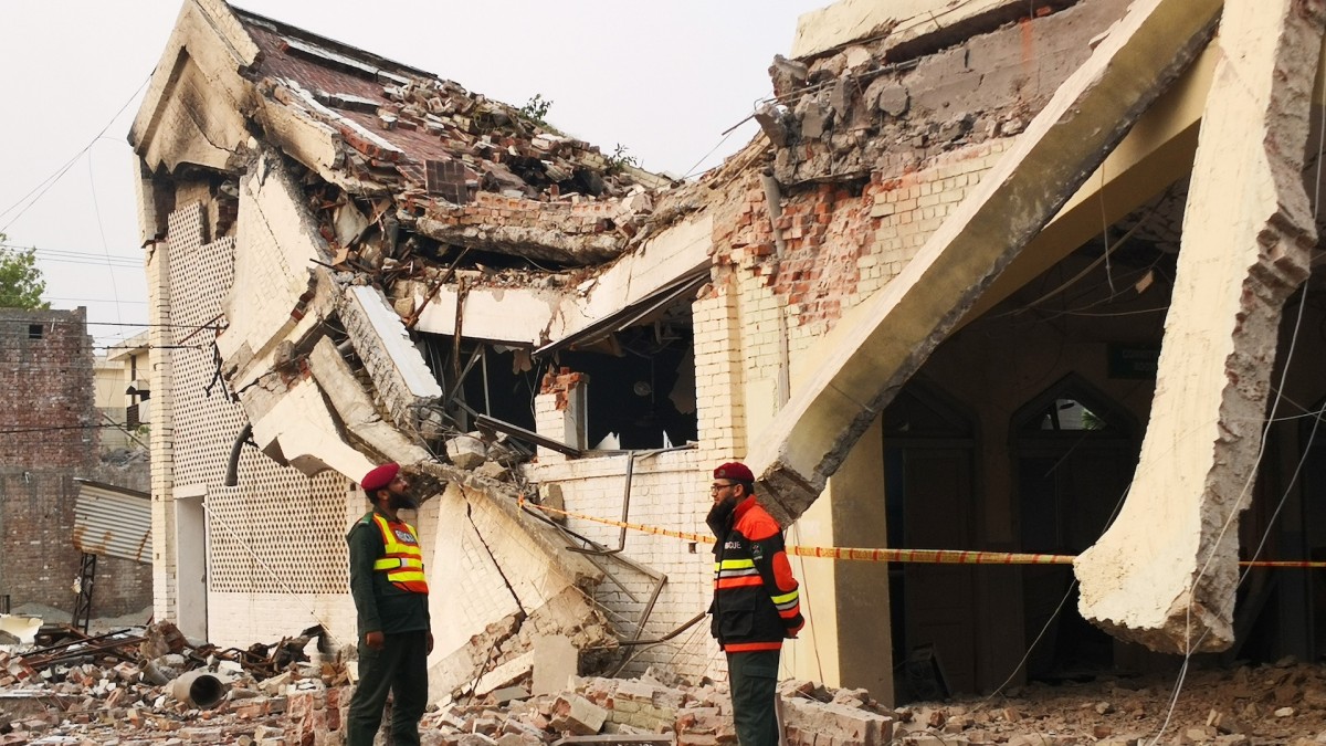 Rescuers examine a building destroyed by an Indian missile attack in Muridke, near Lahore, Pakistan.
