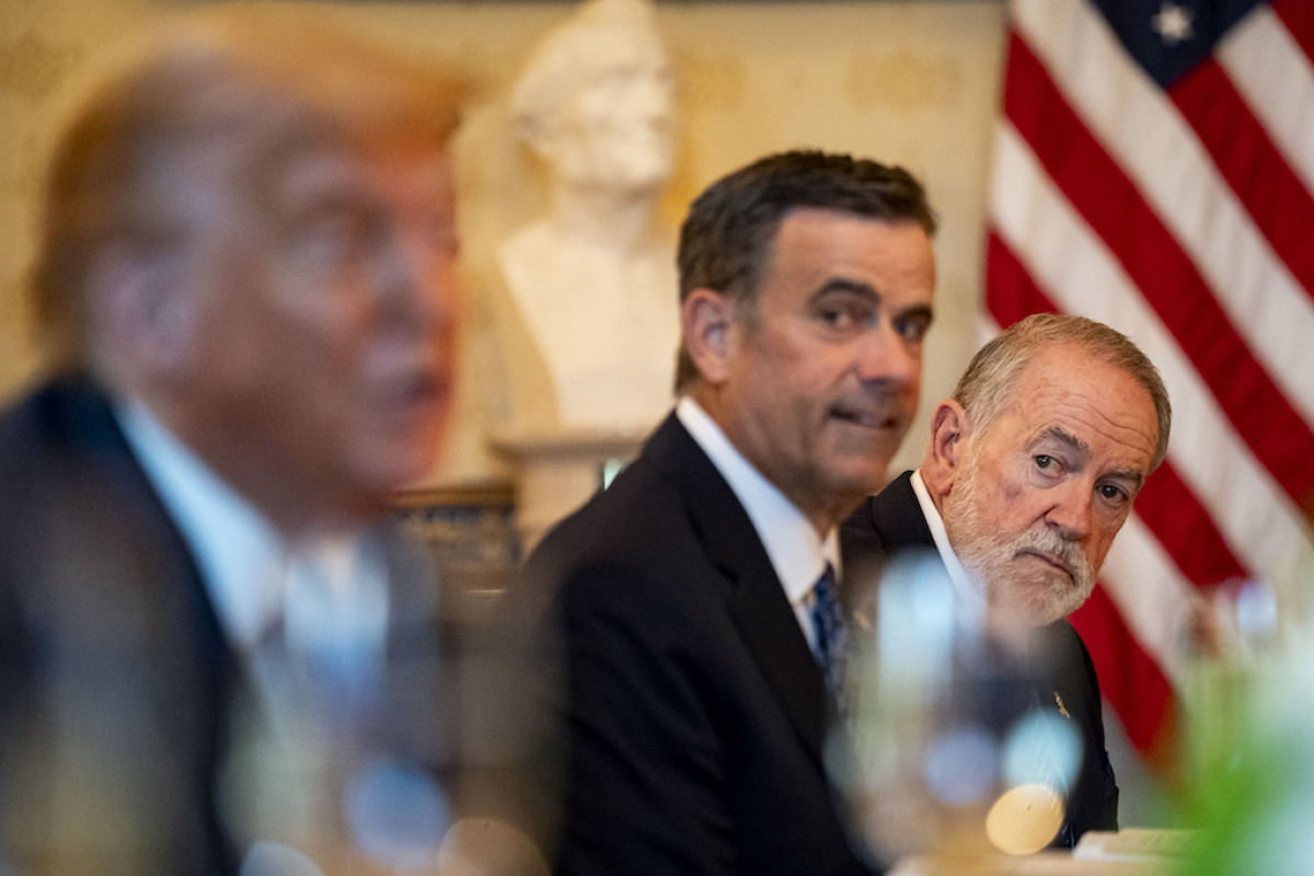 Mike Huckabee, US ambassador to Israel, right, John Ratcliffe, director of the Central Intelligence Agency (CIA), center, during a dinner with US President Donald Trump, left.