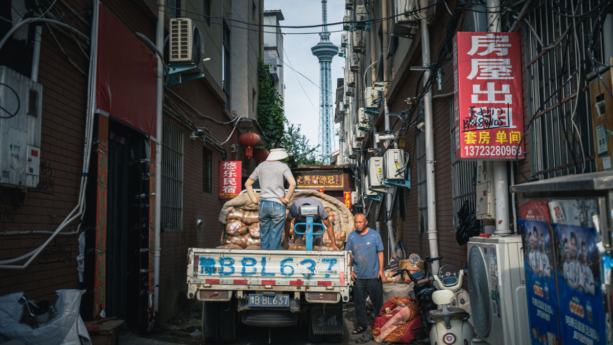 Workers on a street in Shanghai, China.